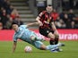 AFC Bournemouth's Lewis Cook in action with Wolverhampton Wanderers' Hwang Hee-chan on October 21, 2023