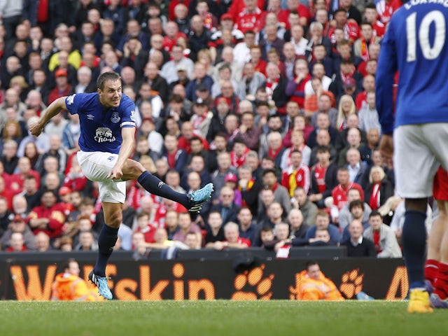 Everton's Phil Jagielka scores a goal against Liverpool on September 27, 2014