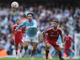 Manchester City's Jack Grealish in action with Nottingham Forest's Gonzalo Montiel on September 23, 2023
