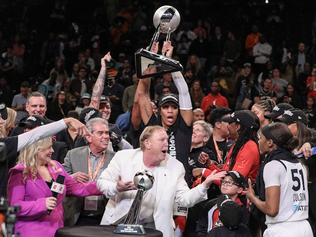The Las Vegas Aces celebrate after defeating the New York Liberty to win the 2023 WNBA Finals on October 18, 2023