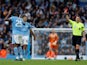 Manchester City's Manuel Akanji reacts after being shown a red card by referee Robert Jones on October 21, 2023