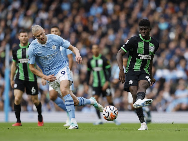 Manchester City's Erling Braut Haaland in action with Brighton & Hove Albion's Carlos Baleba on October 21, 2023