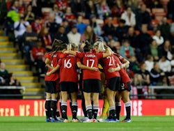 Manchester United Women's players huddle before the match on October 10, 2023