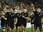 New Zealand's Beauden Barrett and Will Jordan celebrate with teammates after the match on October 18, 2023