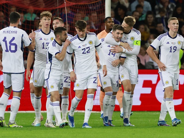 Scotland's Billy Gilmour celebrates scoring their first goal with teammates on October 17, 2023
