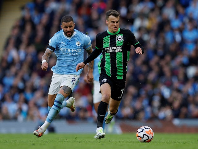 Brighton & Hove Albion's Solly March in action with Manchester City's Kyle Walker on October 21, 2023