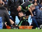 Brighton & Hove Albion's Solly March is placed on a stretcher after sustaining an injury as Lewis Dunk looks on on October 21, 2023