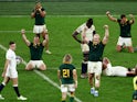 South Africa's Vincent Koch, Deon Fourie and teammates celebrate after the match on October 21, 2023