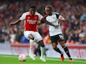 Fulham's Bobby Decordova-Reid in action with Arsenal's Thomas Partey on August 26, 2023