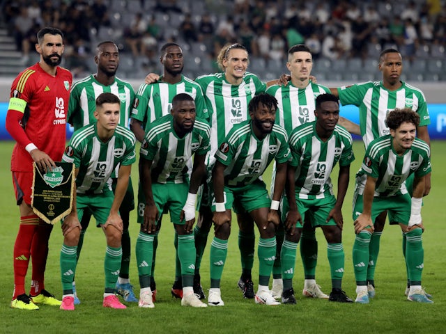 Aris Limassol players pose for a team group photo before the match on October 26, 2023