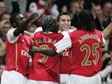 Arsenal players celebrate scoring against Sevilla in 2007