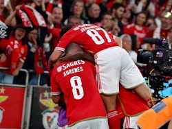 Benfica's Joao Mario celebrates scoring their first goal with teammates on October 28, 2023