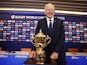 Chairperson of World Rugby, Bill Beaumont poses with the Webb Ellis Cup after the press conference on October 21, 2023