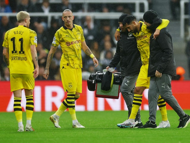 Borussia Dortmund's Emre Can walks to be substituted after sustaining an injury on October 25, 2023