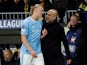 Manchester City's Erling Haaland with manager Pep Guardiola after being substituted on October 25, 2023