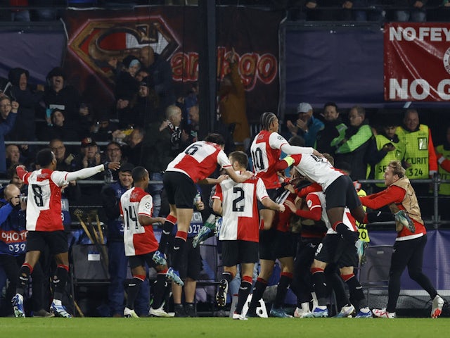 Feyenoord's Santiago Gimenez celebrates scoring their first goal with teammates on October 25, 2023