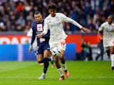 Lille defender Leny Yoro in action with Paris Saint-Germain's Kylian Mbappe in February 2023