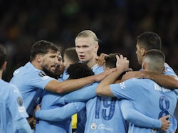 Manchester City's Erling Braut Haaland celebrates scoring their third goal with teammates on October 21, 2023
