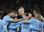 Manchester City's Erling Braut Haaland celebrates scoring their third goal with teammates on October 21, 2023