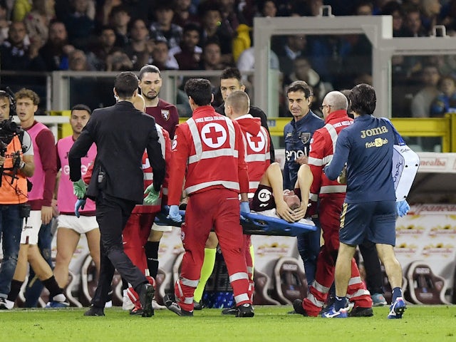Torino's Perr Schuurs is stretchered off after sustaining an injury on October 21, 2023