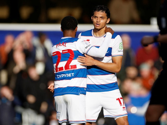 Queens Park Rangers' (QPR) Andre Dozzell celebrates scoring their first goal with Kenneth Paal on October 28, 2023