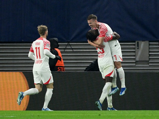 RB Leipzig's Dani Olmo celebrates scoring their third goal with teammate Castello Lukeba on October 25, 2023