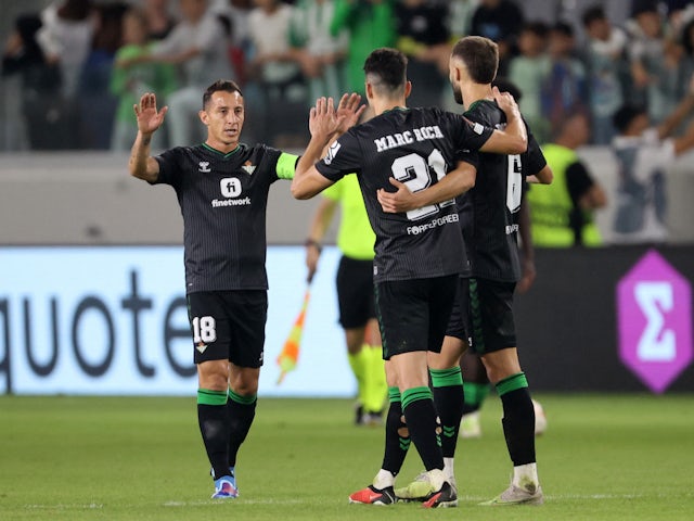 Real Betis' Andres Guardado, German Pezzella and Marc Roca celebrate after the match on October 26, 2023