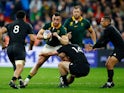 South Africa's Jesse Kriel in action with New Zealand's Will Jordan and Aaron Smith on October 28, 2023