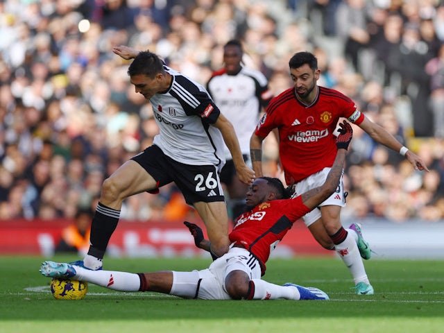 Fulham's Joao Palhinha in action with Manchester United's Aaron Wan-Bissaka and Bruno Fernandes on November 4, 2023