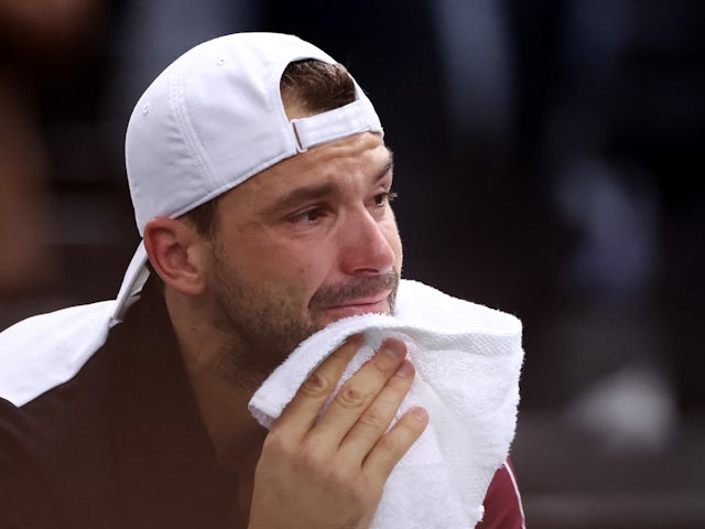 Grigor Dimitrov looks dejected after losing to Novak Djokovic at the Paris Masters on November 5, 2023