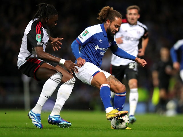 Ipswich Town's Marcus Harness in action with Fulham's Calvin Bassey on November 1, 2023