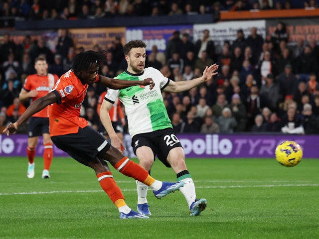 Luton Town's Issa Kabore in action with Liverpool's Diogo Jota on November 5, 2023