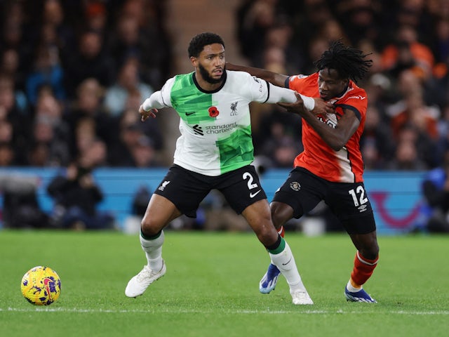 Liverpool's Joe Gomez in action with Luton Town's Issa Kabore on November 5, 2023