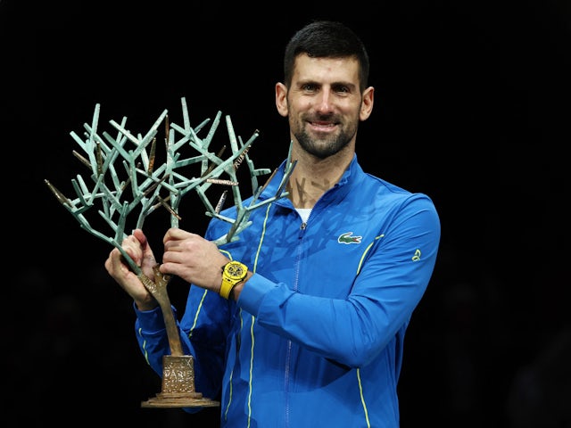 Novak Djokovic poses with the trophy after winning the Paris Masters on November 2, 2023