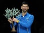 Novak Djokovic poses with the trophy after winning the Paris Masters on November 2, 2023