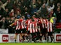 Sheffield United's Cameron Archer celebrates scoring their first goal with teammates on November 2, 2023