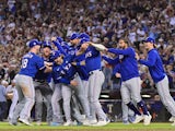 The Texas Rangers storm the field after defeating the Arizona Diamondbacks to win the World Series on November 1, 2023