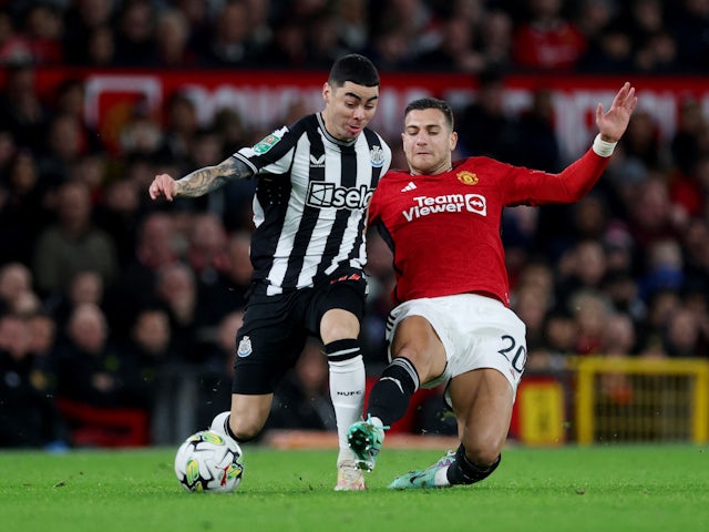 Newcastle United's Miguel Almiron in action with Manchester United's Diogo Dalot on November 1, 2023