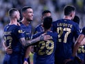 Al Nassr's Aymeric Laporte celebrates scoring their second goal with teammates on November 4, 2023