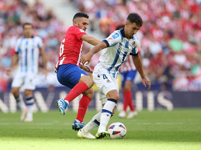 Atletico Madrid's Koke in action with Real Sociedad's Martin Zubimendi on October 8, 2023