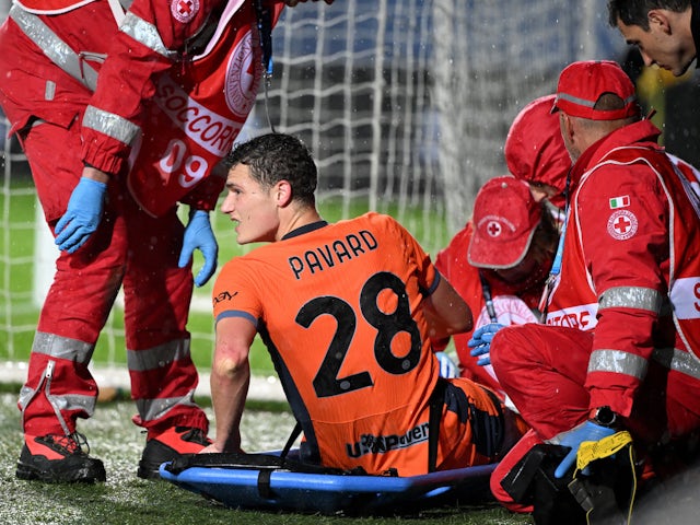 Inter Milan's Benjamin Pavard receives medical attention on a stretcher after sustaining an injury on November 4, 2023