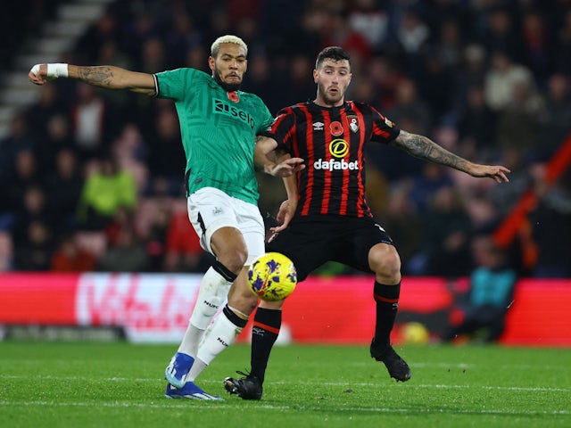 Newcastle United's Joelinton in action with AFC Bournemouth's Marcos Senesi on November 11, 2023