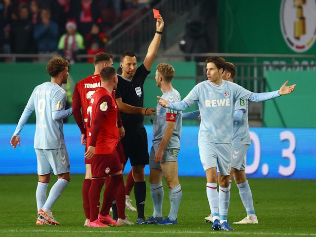 FC Koln's Florian Kainz is shown a red card by referee Sven Jablonski on October 31, 2023