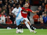 Crystal Palace's Jesurun Rak-Sakyi in action with Manchester United's Sofyan Amrabat on September 26, 2023
