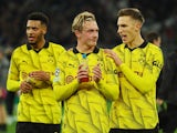 Borussia Dortmund's Julian Brandt and Nico Schlotterbeck celebrate after the match on November 7, 2023