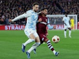 Olympiacos' Kostas Fortounis in action with West Ham United's Said Benrahma on November 9, 2023