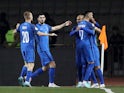 Azerbaijan's Emin Makhmudov celebrates scoring their first goal with teammates on November 16, 2023