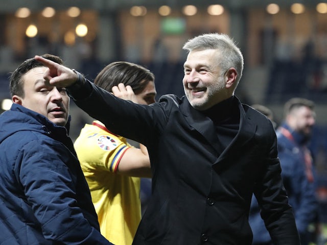 Romania coach Edward Iordanescu celebrates after qualifying for the Euro 2024 on November 18, 2023