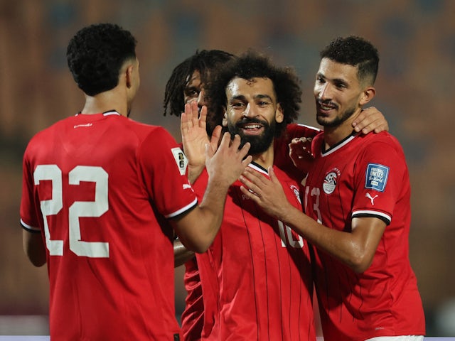 Egypt's Mohamed Salah celebrates scoring their fourth goal with teammates on November 16, 2023