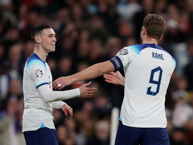 England's Phil Foden and Harry Kane celebrate their first goal an own goal scored by Malta's Enrico Pepe on November 17, 2023
